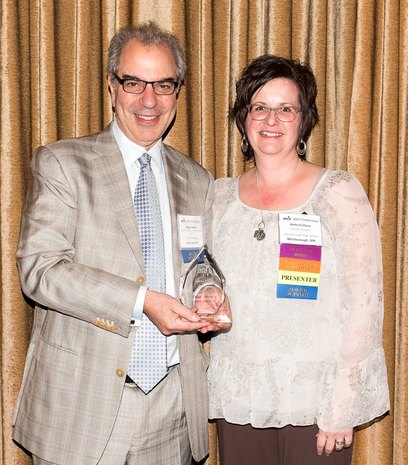 Roger Rosen, School Library Advocate Award recipient receives congratulations from Anita Cellucci, MSLA president.