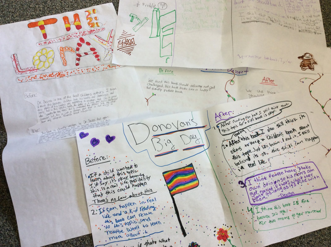 Pictures of student work written on large pieces of white paper. The sheets are covered in colorful decorations done in marker and student impressions on the two books, The Lorax and Donovan's Big Day.