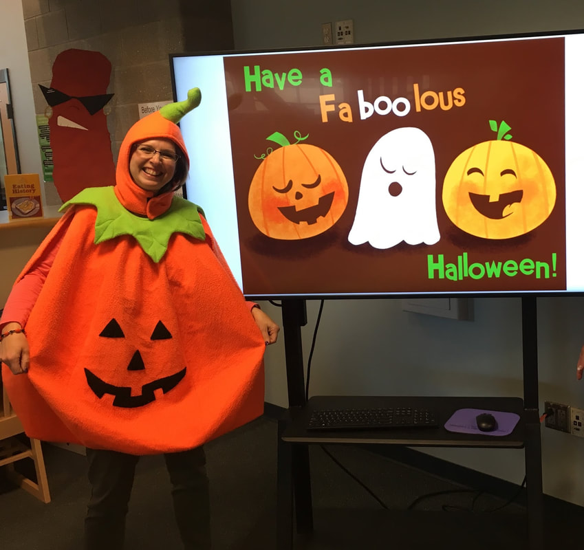 Librarian in pumpkin costume