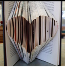 Book with pages folded into a heart shape