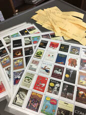 Laminated bingo sheets with the covers of various banned books